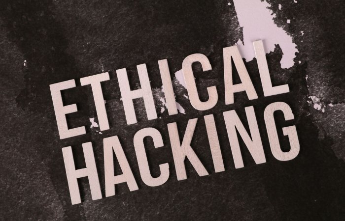 Creative depiction of the term 'Ethical Hacking' on a dark artistic background.